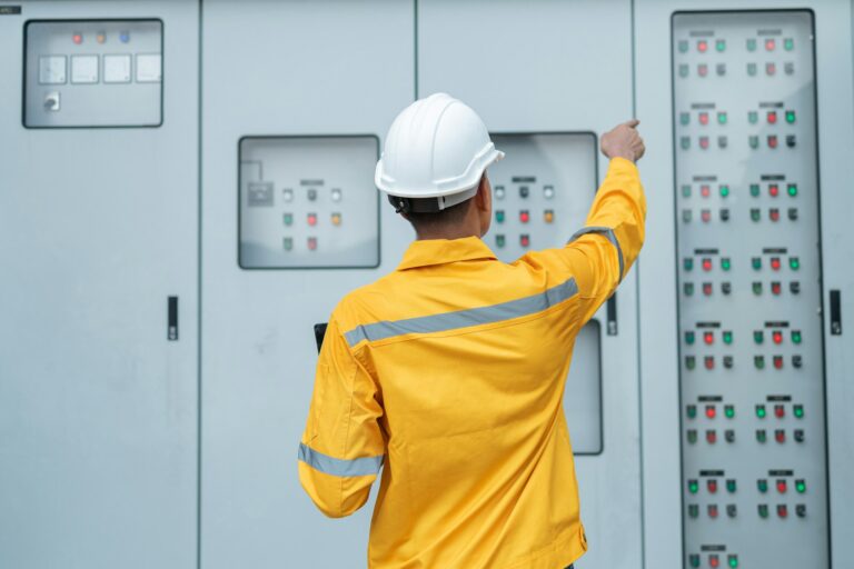 Electrical Engineer Monitoring Systems on Laptop